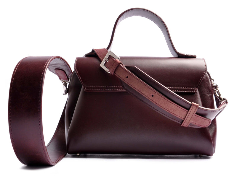 ARROW TOTE satin-finished calfskin in burgundy red . With one adjustable Statement and one narrow strap . OSTWALD Leather Manufactory
